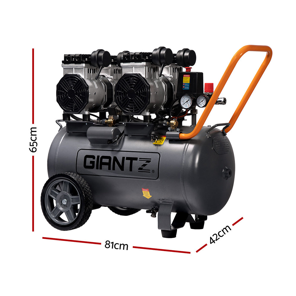 The large, black Giantz 50L Air Compressor 3.0HP Oil-Free Quiet Electric Portable Air Inflator boasts an efficient oilless lubrication system and a spacious 50L compressor. It features two black motors on top, pressure gauges, and a control panel on one side. With two large wheels, a small front support, and an orange handle, it ensures easy maneuverability.