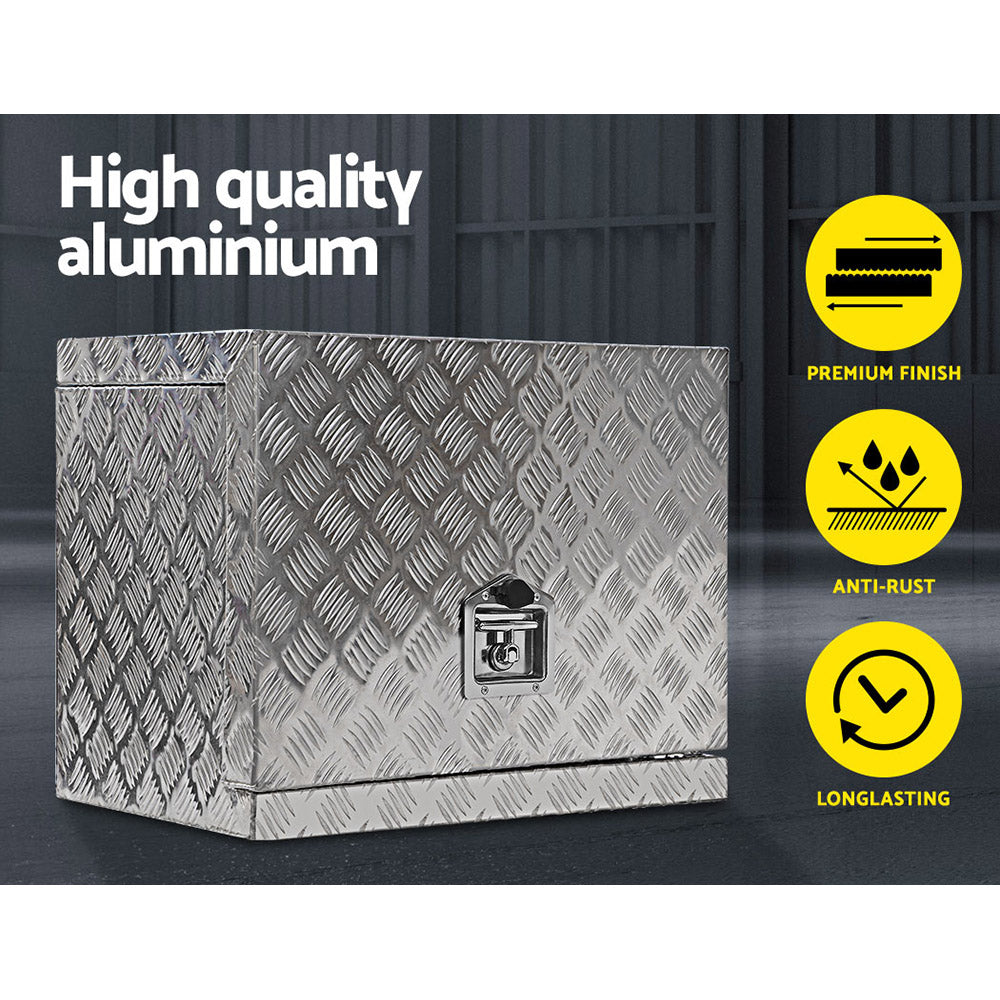 A durable aluminium tool box, this metallic, cube-shaped storage solution features a textured, diamond-plate surface. It has a secure latch at the front for locking. Reflecting light effortlessly, it's built to withstand heavy-duty or industrial use, making it an ideal Giantz Aluminium Ute Tool Box Generator Trailer Truck Storage Lock.