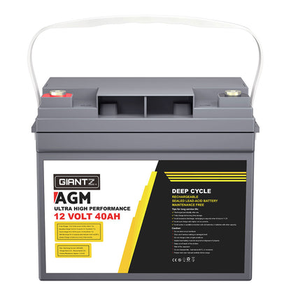 A gray Giantz AGM Battery 12V 40Ah Deep Cycle Box Portable Solar Caravan Camping with a white handle, rated at 12 volts and 40 ampere-hours (AH). This portable power source features red and black terminals and a detailed label on the front outlining its innovative AGM Technology and performance specs.