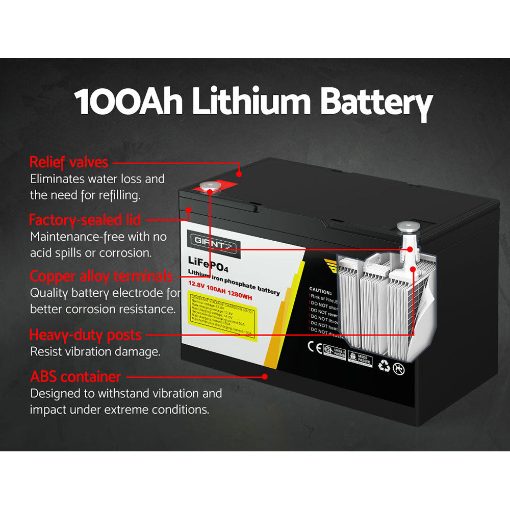 A black Giantz 12V 100Ah Lithium Battery LiFePO4 Deep Cycle Box Solar Caravan Camping with a capacity of 12.8V, 100Ah, and 1280Wh. It has a label with the brand "Giantz," safety warnings, certifications, and handling instructions. Ideal for emergency power or outdoor use, it features two protruding handles on top for easy carrying.