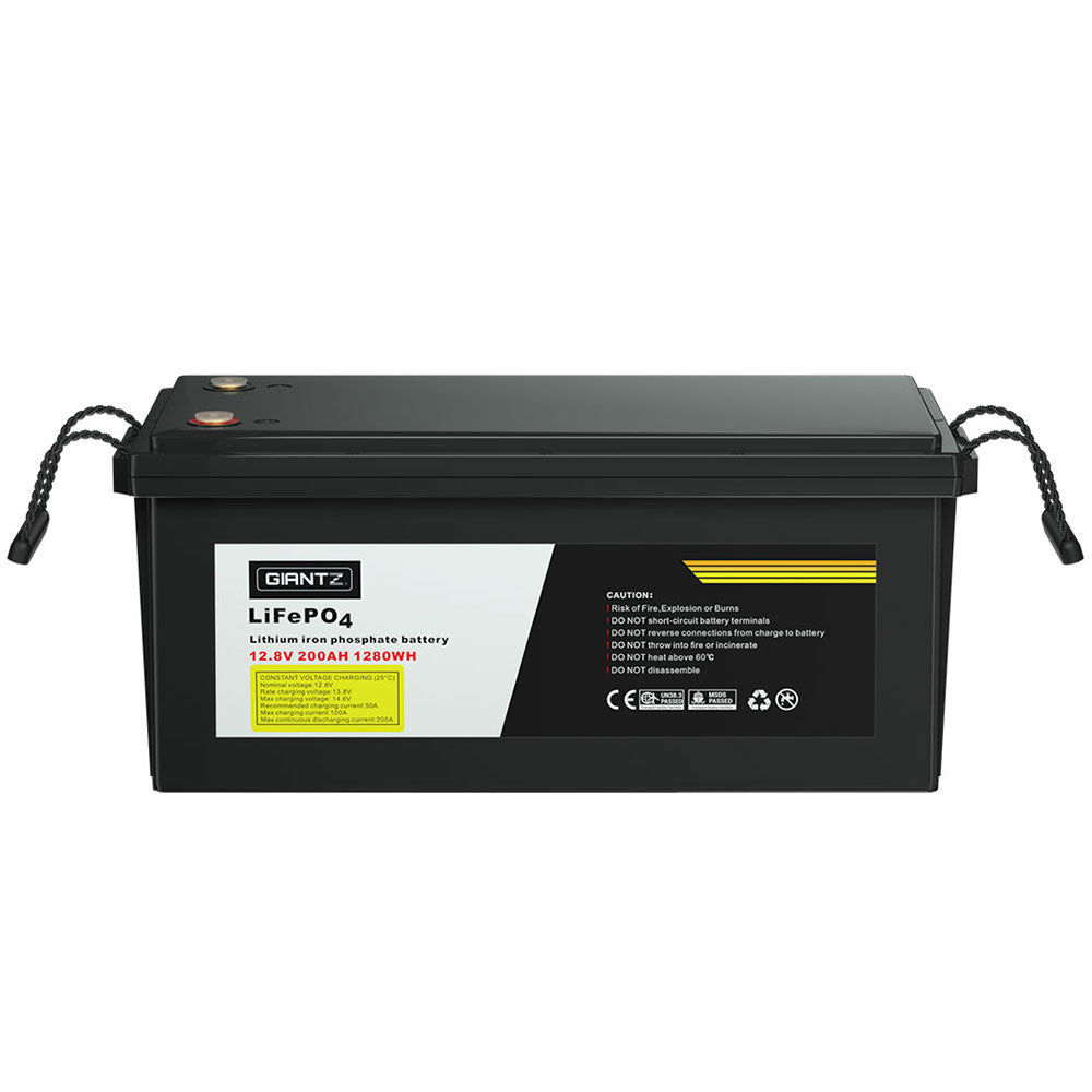 A black rectangular Giantz 12V 200Ah Lithium Battery LiFePO4 Deep Cycle Box Solar Caravan Camping, featuring two side handles and yellow text on the label. The label indicates a capacity of 12.8V 200Ah 12.02Wh and brand name "GIANTZ." Safety and technical information are also included, making it perfect for emergency power needs or as a car battery replacement.