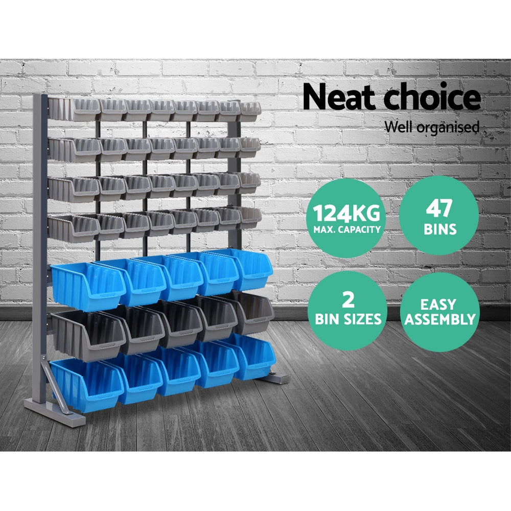 An organization setup featuring a Giantz 47 Storage Bin Rack Wall Mounted Steel Stand with multiple gray and blue bins filled with various screws and hardware. Tools and a drill are visible on a workbench with drawers beneath. A magnetic tool bar holds essentials, while text states "Versatile storage" and highlights bin dimensions.