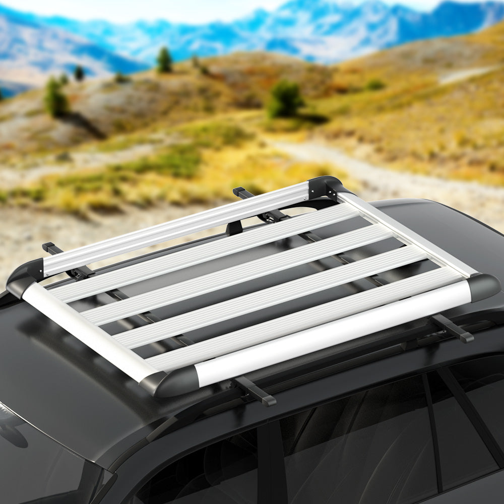 The Giantz Universal Car Roof Rack Basket Luggage Vehicle Cargo Carrier 140cm Silver is a sleek, silver roof rack with a rectangular frame and parallel bars designed to attach to your vehicle's roof. Perfect for carrying camping essentials, it features black corner pieces and mounting brackets for secure placement.