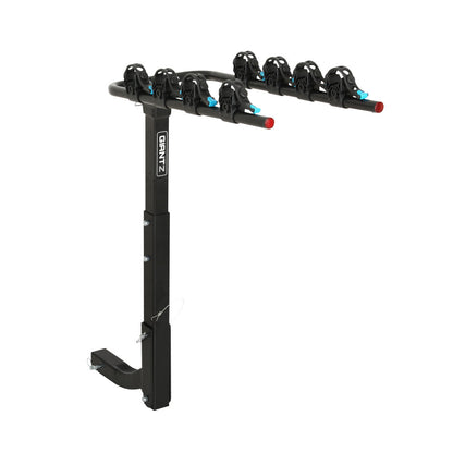 A black Giantz 4 Bicycle Carrier Bike Rack Car Rear Hitch Mount 2" Towbar Foldable designed to hold four bicycles, featuring a sturdy vertical support made of durable powder-coated steel with mounting hardware at the base. Horizontal arms with individual clamps and blue accents secure each bike. The brand name "Gran Z" is visible on the vertical bar for hassle-free storage.