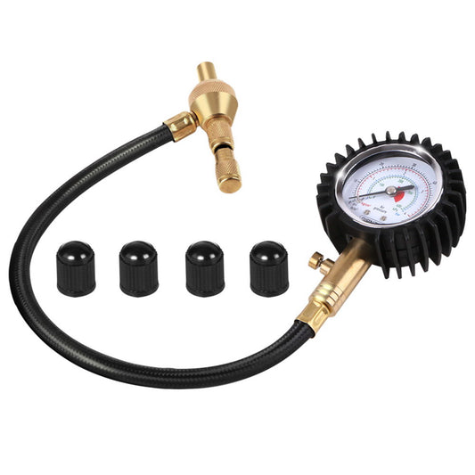 A Giantz 4X4 4WD Gauge Valve Rapid Tyre/Tire Deflator with a black rubber hose and brass fittings is shown. The gauge has a dial with measurements and a protective black rubber cover. Four black valve caps are lined up next to it, making it an essential off-road tool for precise tire management.