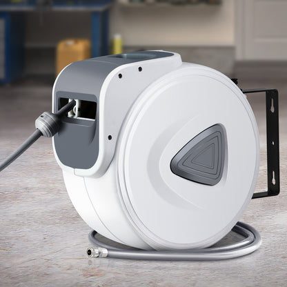 A Giantz Air Hose Reel 20m Retractable Rewind Swivel Wall Mount Compressor Garage, featuring a UV-resistant PVC hose, is mounted on a black bracket. The hose is partially extended with the nozzle resting in a slot on the side of the reel.