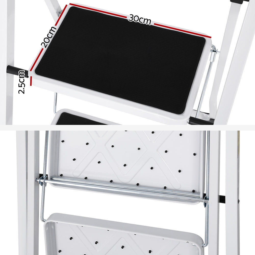 A white, two-step foldable ladder with black steps and non-slip rubber feet stands on a plain white background. The Giantz 2 Step Ladder Multi-Purpose Folding Steel Light Weight Platform has a simple, lightweight metal frame designed for household use.