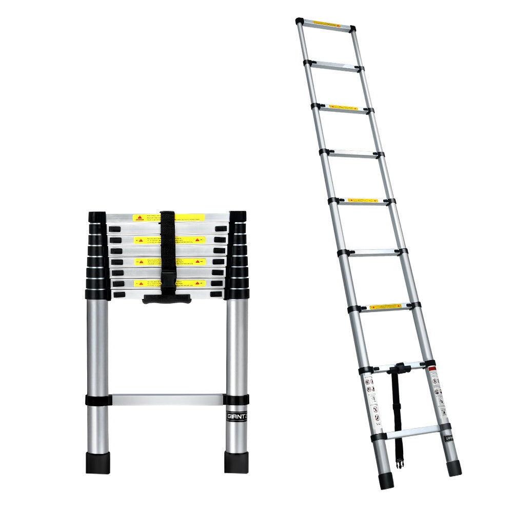 A collapsible Giantz 2.6M Telescopic Ladder Aluminium Extension Extendable Steps Adjustable Height is seen in both its extended and compact forms. The extended ladder, made from premium aluminum alloy, shows multiple rungs with safety labels. The compact version is neatly folded with securing straps and anti-slip end caps for stability.