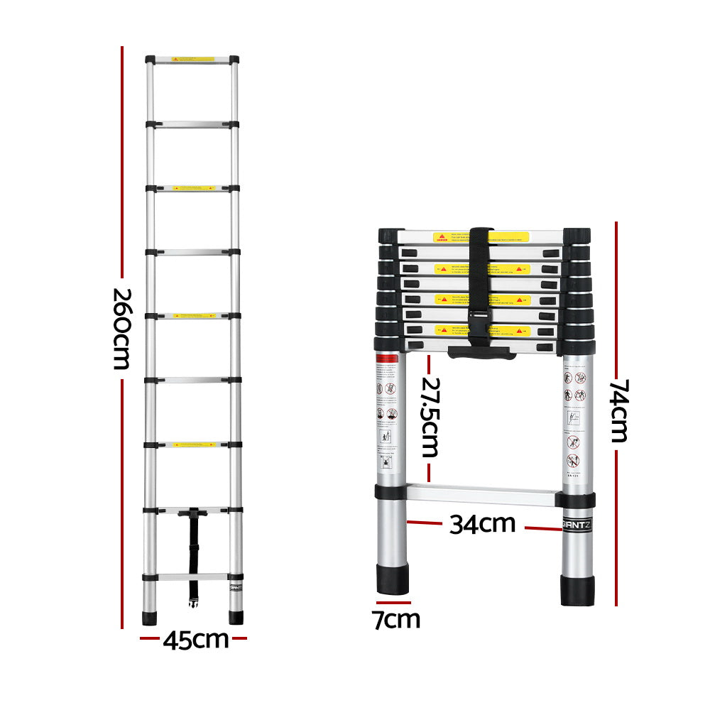 A collapsible Giantz 2.6M Telescopic Ladder Aluminium Extension Extendable Steps Adjustable Height is seen in both its extended and compact forms. The extended ladder, made from premium aluminum alloy, shows multiple rungs with safety labels. The compact version is neatly folded with securing straps and anti-slip end caps for stability.