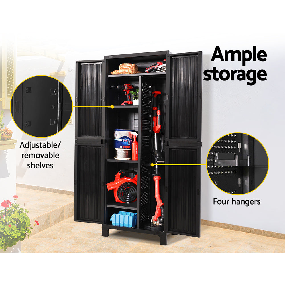 A black Gardeon 173cm Outdoor Storage Cabinet Box Lockable Cupboard Sheds Garage Adjustable reveals organized, adjustable shelves. Inside are red power tools, a small plant, a hat, cleaning supplies, a hose reel, and a box. The weather-resistant cabinet houses items like a handheld vacuum and hedge trimmer among other assorted gear.