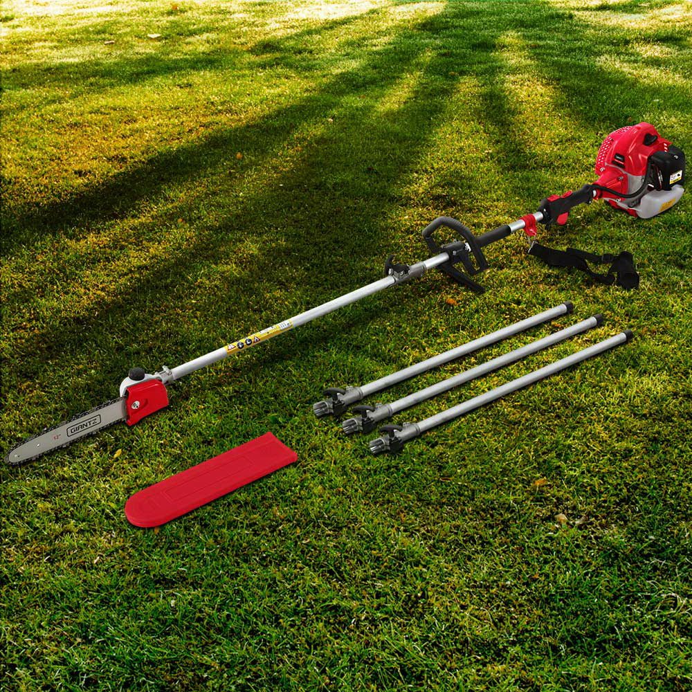 A red and silver Giantz 65CC Pole Chainsaw 12in Chain Saw Petrol 5.6m Long Reach with an extended handle attachment rests on a white background. The 65cc commercial-grade saw, featuring an anti-vibration system, includes three extension poles and a red blade cover positioned beside it, appearing ready for tree trimming or similar tasks.