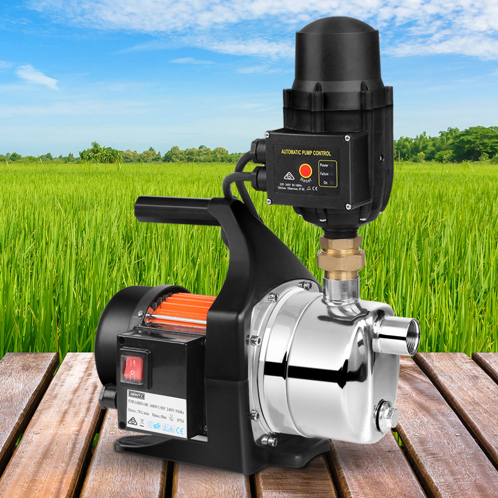 A Giantz Garden Water Pump High Pressure 1500W Tank Rain Farm Irrigation House Black with a black motor housing, red cooling fins, and built-in automatic pump control. The shiny metallic body features a pressure gauge and multiple connections for water inlet and outlet, making it perfect for irrigation tasks.