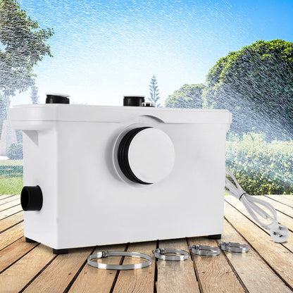 A white Giantz Macerator Sewerage Pump Waste Water Marine Toilet Disposal Laundry Unit with a powerful 600W motor, featuring three ports on top, one large central port on the front, and one port on the side. It includes a power cord with a dual-pin plug. Four hose clamps are placed in front of the pump.