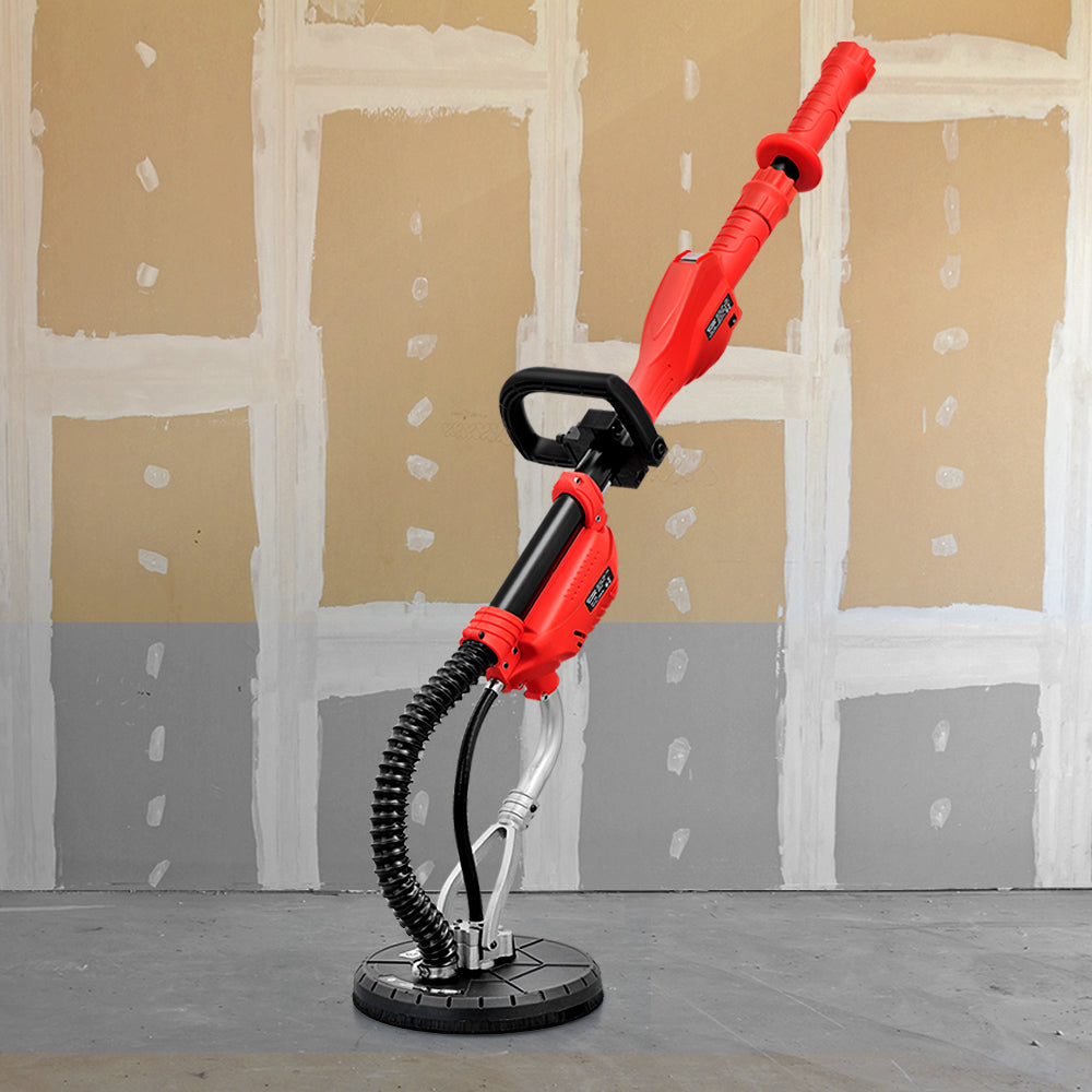 A red Giantz 800W Drywall Sander Plaster Wall Board Dust with a long handle and a circular sanding base, powered by an 800W motor. It features an adjustable black handle midway up the shaft for better grip and control, along with a flexible dust extraction hose attached to the sanding base for professional sanding results.