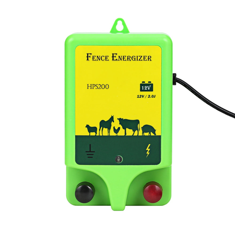 A green and yellow battery-powered Electric Fence Energiser labeled "Giantz 18km Electric Fence Energiser 1.56J" features images of livestock on it. The device includes a power indicator and two knobs. Attached are black and red cables with alligator clips for connection, ensuring reliable livestock protection.