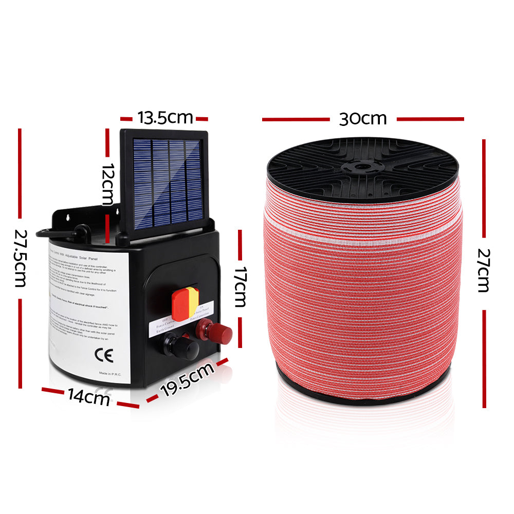 A solar-powered electric fence charging kit designed for livestock protection. It includes a Giantz Fence Energiser 5KM Solar Powered Electric 1200M Poly Tape with a black monocrystalline solar panel, red and white electric fence wire, an alligator clip electrical lead set, and a yellow and black "Shock Warning" sign. Various switches and connectors are on the charger.