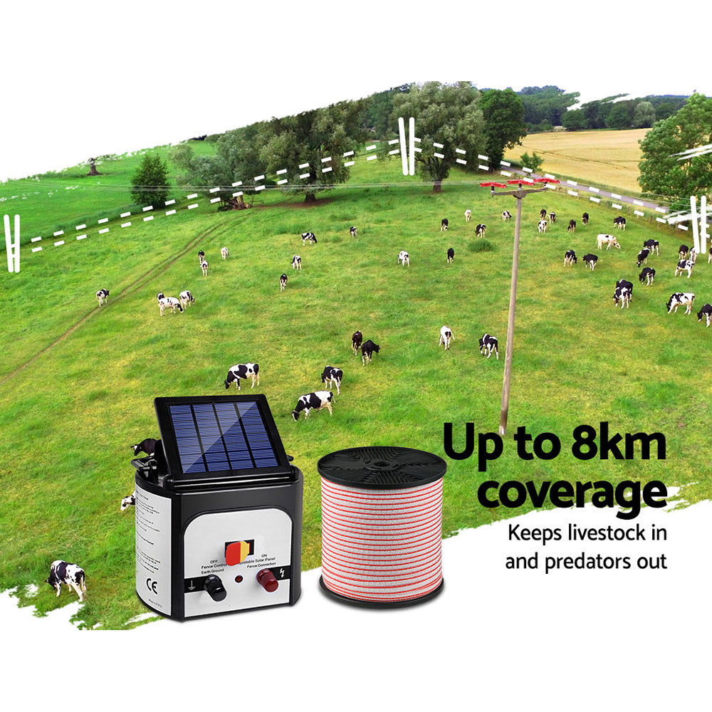 Image of a Giantz Fence Energiser 8KM Solar Powered Electric 400M Poly Tape Insulator featuring a spool of red and white fencing wire, various connectors and cables, and a yellow "Shock Warning" sign with a hand being struck by an electric bolt. Ideal for effective livestock containment.