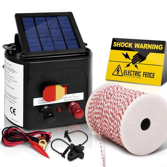 A Giantz Fence Energiser 5KM Solar Powered Electric 500M Poly Wire Insulator kit ideal for livestock fencing, featuring a black control unit with a small solar panel on top, connectors, and switches. Includes red and white striped fencing wire, black clips, and a yellow "Shock Warning" sign indicating electric fence danger. Low maintenance.