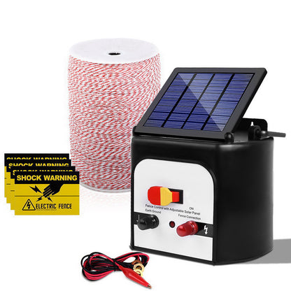 A Giantz Fence Energiser 8KM Solar Powered Electric 2KM Poly Wire with a connected control box, monocrystalline solar panel, and wires. The set also includes a large spool of red and white electric fencing wire for livestock protection, along with several yellow "Shock Warning" signs.