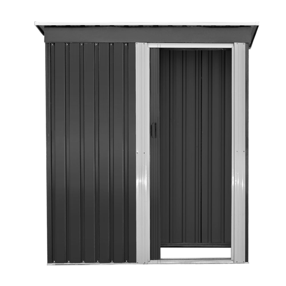 A modern, small black Giantz Garden Shed 1.62x0.86M Sheds Outdoor Storage Tool Workshop House Shelter Sliding Door with a silver-colored door and trim. Constructed from galvanized steel, it features a slanted roof and vertical ridges along the walls and door, designed for weatherproof outdoor storage. The slightly open door offers a glimpse of the interior.