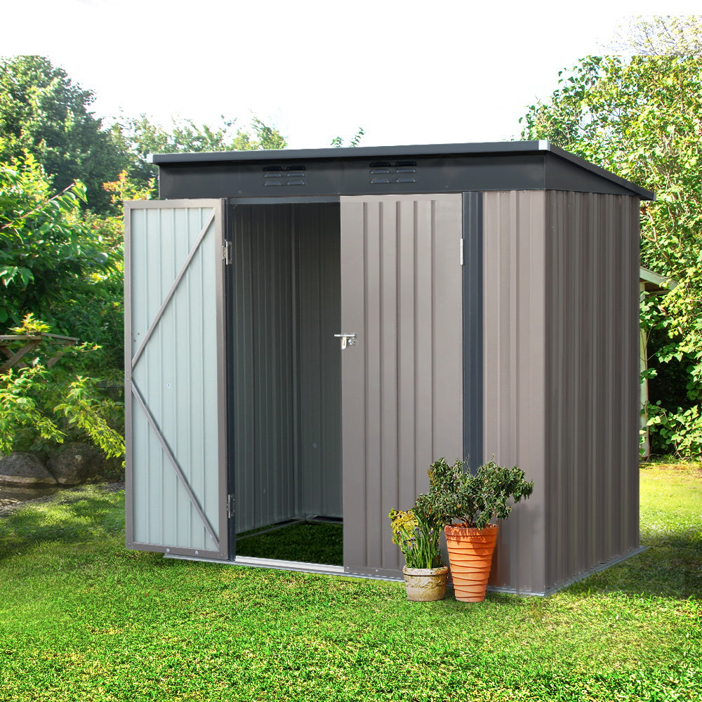 A small, grey Giantz Garden Shed 1.95x1.31M Sheds Outdoor Storage Steel Workshop House Tool Double Door with a slightly slanted roof and open double doors. Constructed from galvanized steel, it reveals a spacious interior perfect for storage. The shed is set against a plain background, offering robust weatherproof protection for your belongings.
