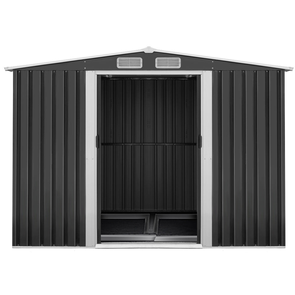 A black galvanized steel Giantz Garden Shed 2.58x3.14M w/Metal Base Sheds Outdoor Storage Workshop Shelter Sliding Door with open double doors reveals the empty interior. The weatherproof shed has side ventilation panels near the roofline and a gabled roof. It offers an ideal storage solution for outdoor equipment and tools.