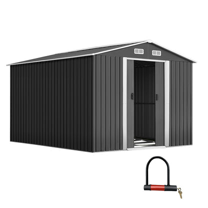 A plain black corrugated metal wall, made from galvanized steel, features a vertical ribbed pattern and a matching flat roof. The Giantz Garden Shed 2.6x3.9M w/Metal Base Sheds Outdoor Storage Workshop Tool Shelter Sliding Door facade is minimalistic and industrial, with no windows or doors visible. The entire weatherproof structure appears boxy and utilitarian, reminiscent of a metal garden shed.