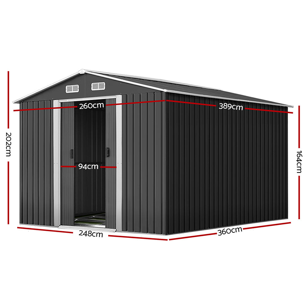 A plain black corrugated metal wall, made from galvanized steel, features a vertical ribbed pattern and a matching flat roof. The Giantz Garden Shed 2.6x3.9M w/Metal Base Sheds Outdoor Storage Workshop Tool Shelter Sliding Door facade is minimalistic and industrial, with no windows or doors visible. The entire weatherproof structure appears boxy and utilitarian, reminiscent of a metal garden shed.