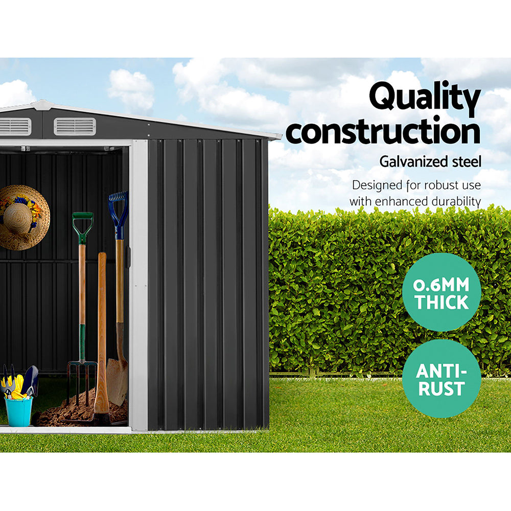 A plain black corrugated metal wall, made from galvanized steel, features a vertical ribbed pattern and a matching flat roof. The Giantz Garden Shed 2.6x3.9M w/Metal Base Sheds Outdoor Storage Workshop Tool Shelter Sliding Door facade is minimalistic and industrial, with no windows or doors visible. The entire weatherproof structure appears boxy and utilitarian, reminiscent of a metal garden shed.