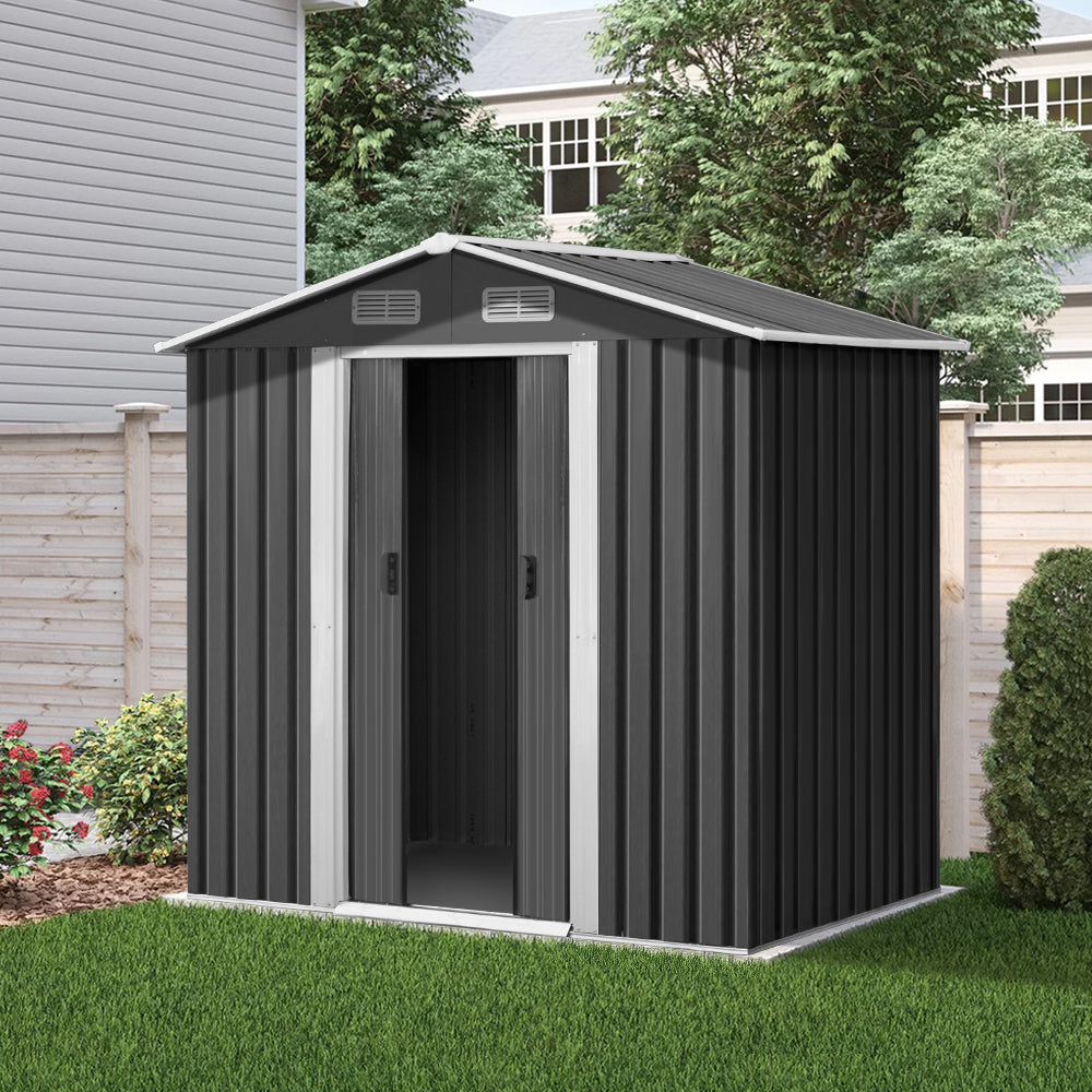 Image of a Giantz Garden Shed 1.96x1.32M Sheds Outdoor Storage Tool Workshop Metal Shelter Sliding Door in black with white trim. The weatherproof shed features double doors, two small vents near the roof, and various dimensions labeled in red: height 186cm, front width 132cm, back width 196cm, door height 154cm, door width 73cm, depth 119cm, and total width 184cm.