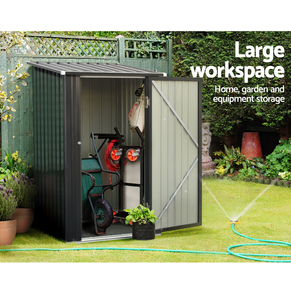 A small, vertical black Giantz Garden Shed 0.99x1.04M Sheds Outdoor Tool Storage Workshop House Steel with a corrugated roof and single door. Crafted from weatherproof galvanized steel, the shed features a secure latch with a padlock. The structure has grooved panels and rests on a rectangular base, making it ideal for outdoor use.