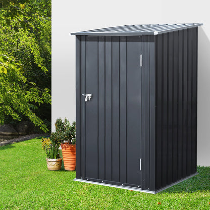 A small, vertical black Giantz Garden Shed 0.99x1.04M Sheds Outdoor Tool Storage Workshop House Steel with a corrugated roof and single door. Crafted from weatherproof galvanized steel, the shed features a secure latch with a padlock. The structure has grooved panels and rests on a rectangular base, making it ideal for outdoor use.