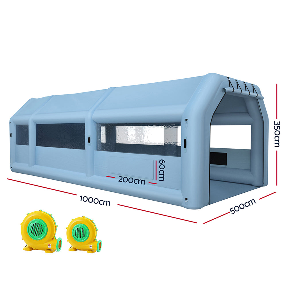 Image of a Giantz Inflatable Spray Booth 10X5M Car Paint Tent Filter System 2 Blowers, a large, blue, rectangular tunnel-like structure with transparent windows on the sides and front. Made from high-quality 201D oxford cloth, it has a flat base and is designed to appear modular, potentially used for transport, storage, or scientific purposes.