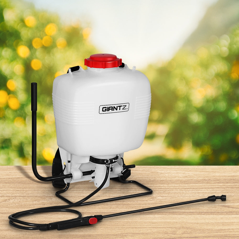 A white, plastic backpack sprayer with a red cap. The Giantz Weed Sprayer 15L Knapsack Backpack Plastic features adjustable black shoulder straps, a manual hand pump on the side, and a long black spray wand attached to it with a hose. This 15L capacity sprayer is perfect for various tasks.