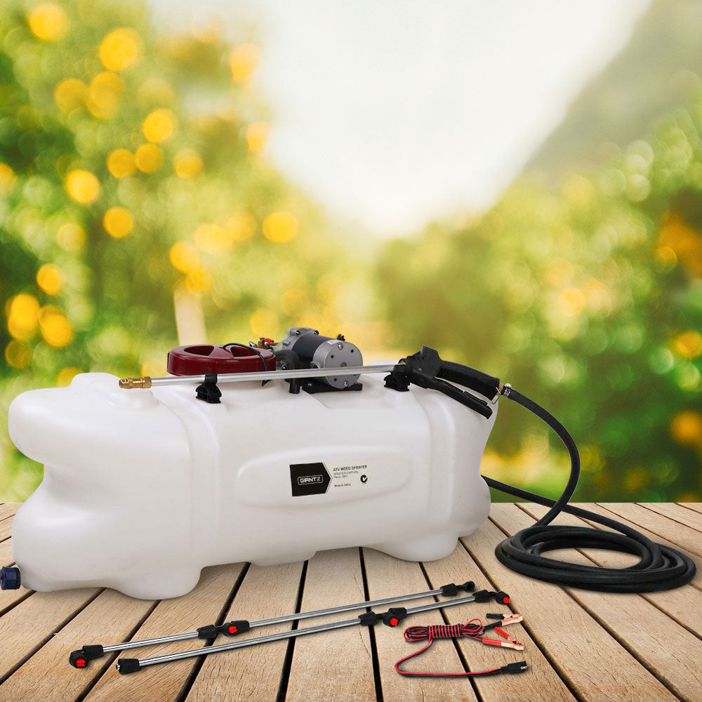 A white, portable agricultural sprayer with a red cap and a small motor fixed on top. It includes a long black hose and three metal spray wands with red-tipped nozzles. Featuring a UV stable design, the Giantz Weed Sprayer 60L 1.5M Fixed Boom Garden Spray boasts durability and efficient performance for all your spraying needs.