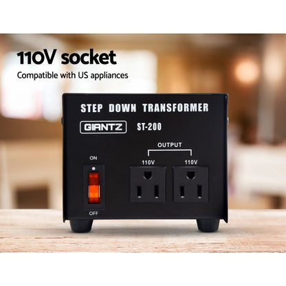 Image of a black Giantz Step Down Transformer 200W 240V TO 110V Stepdown Voltage Converter AU-US with the model number "ST-200" displayed. It has an on/off switch, two 110V output sockets, and features such as low heat generation, low noise, bonus fuse, pure sine output, and converts 240V to 110V written around it.