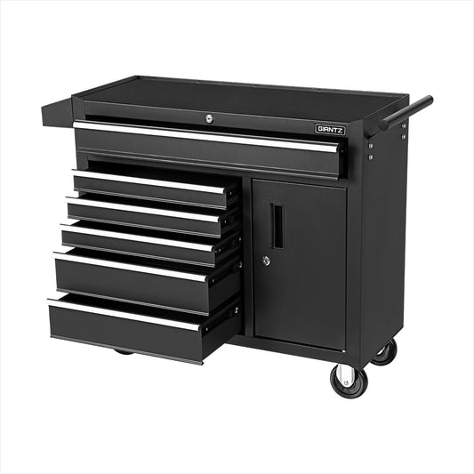 A black multi-drawer Giantz 6 Drawer Tool Box Chest Cabinet Toolbox Storage Garage Organiser Wheels with four open drawers and one closed cabinet. The chest features side handles and five wheels for mobility. The brand "Grantz" is visible on the top right side, and the trolley is placed against a white background.