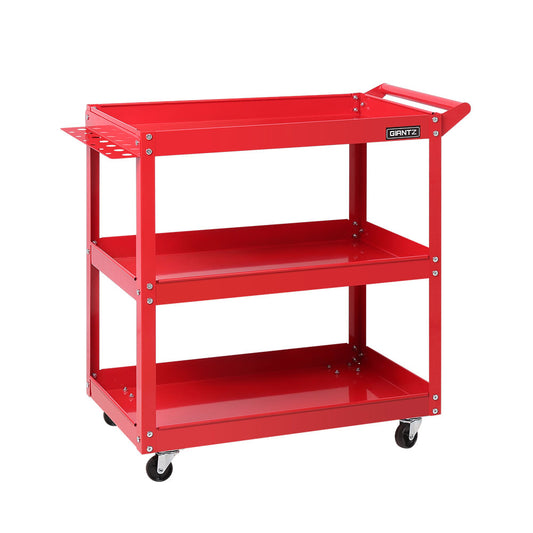 A red, three-tier Giantz 3-Tier Tool Cart Trolley Workshop Garage Storage Organizer Red crafted from heavy-duty steel on four swivel caster wheels. The cart features a handle on one end and a small perforated tray attached to one of the shelves. Each tier has a raised edge to prevent items from falling off. Brand name "GRANTZ" is visible on the side.