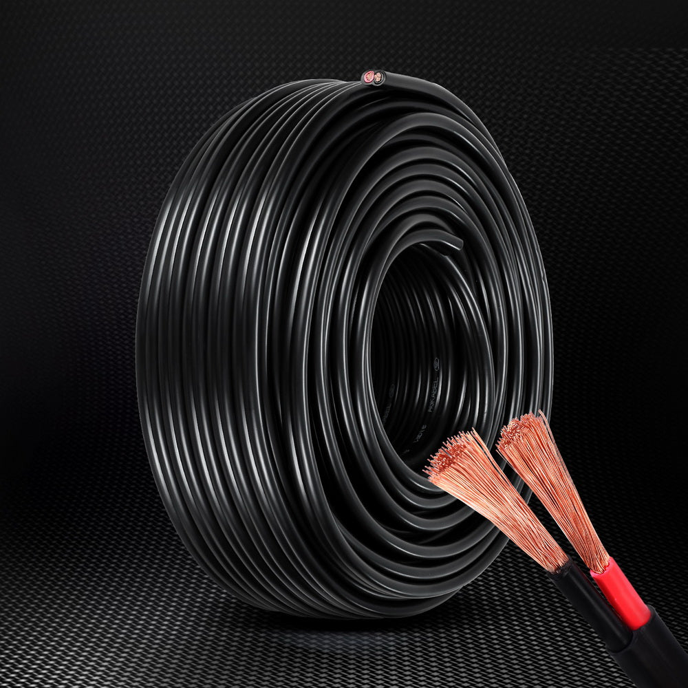 A large coil of black electrical cable is shown. The cut ends reveal red and black copper wires inside, indicating two conductors. The exposed, flexible oxygen-free copper strands ensure optimal conductivity and durability, making it perfect as a Giantz 8B&S 30M Twin Core Wire Electrical Cable Extension Car 450V 2 Sheath.