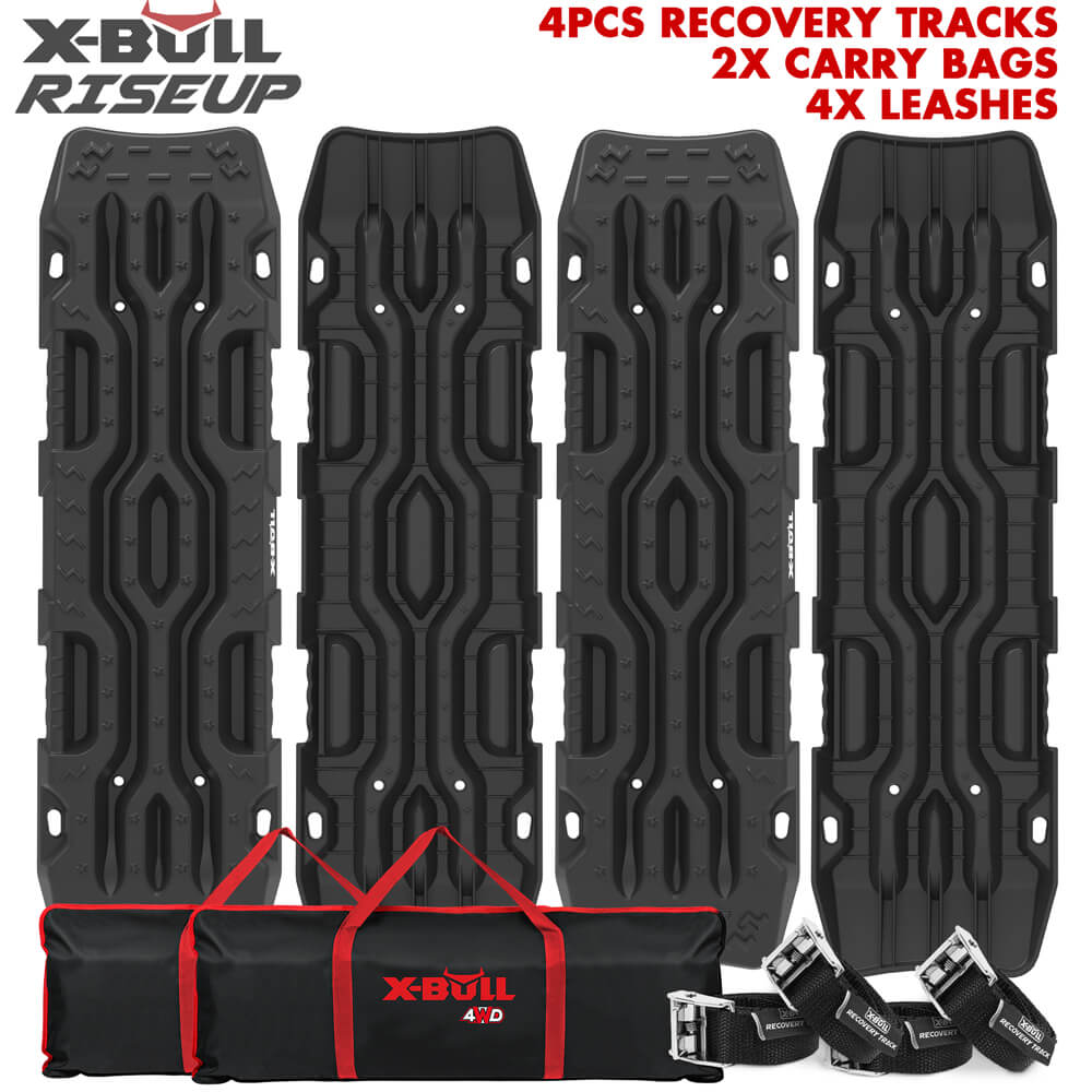 An image displaying four black X-BULL Recovery Tracks Boards 4PCS 12T Sand Snow Mud tracks 4WD Car Truck RISEUP with textured surfaces, arranged vertically. Below the tracks are two black carry bags with red accents and the X-BULL 4x4 logo, along with four leashes with metal clips. Text reads "4PCS RECOVERY TRACKS 2X CARRY BAGS 4X LEASHES".