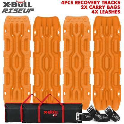 The image displays four orange X-BULL 4X4 Recovery Tracks Boards 4PCS Sand Mud Snow Tracks Car Truck 4WD RISEUP lined up vertically. At the bottom, there are two black carrying bags and four black leashes. The text at the top right reads, "4PCS RECOVERY TRACKS, 2X CARRY BAGS, 4X LEASHES." The X-BULL logo is shown top left.