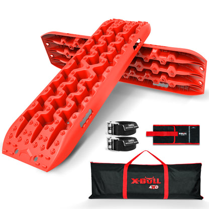 The image features a pair of bright red X-BULL 2PCS Recovery Tracks Boards Snow Mud Truck 4WD With Carry bag Red arranged in an "X" shape. The set includes two XBULL leashes with buckles, a black and red container, and a black and red carrying bag labeled "X-BULL 4WD." The nylon material ensures durability.