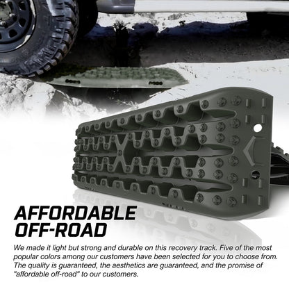 A pair of dark green X-BULL Recovery tracks kit Boards 4WD strap mounting 4x4 Sand Snow Car qrange GEN3.0 6pcs OLIVE with a rugged design is shown. Beside them are a carrying bag, two straps, and a booklet featuring off-road adventure tips and images.