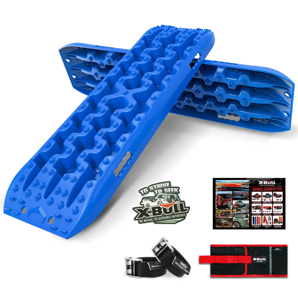 A pair of blue X-BULL Recovery tracks kit Boards 4WD strap mounting 4x4 Sand Snow Car qrange GEN3.0 6pcs blue with a unique U-shape design are shown crossed, accompanied by a black carrying bag, two black straps, and a red bag displayed below them. A brochure showcasing various products and the X-BULL logo are also included in the image.