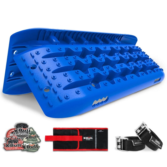 A pair of X-BULL KIT2 Recovery tracks kit Board Traction Sand trucks strap mounting 4x4 Sand Snow Car blue 6pcs placed diagonally. Accompanying them are a set of X-BULL branded stickers, a red and black recovery kit bag, and a black towing strap. Crafted from durable nylon material, the recovery tracks have spikes and grooves designed for off-road vehicle recovery.