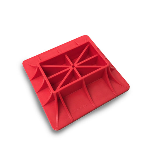 A red plastic square X-BULL Hi Lift Jack Base Plate for Mud & Sand Recovery High Farm Jack 4X4 4WD with a hollow center and multiple support ribs. The item, crafted from high quality polymer, is placed on a white background, showcasing its geometric design and even structure.