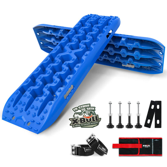 Two blue X-BULL Recovery tracks Sand tracks KIT Carry bag mounting pin Sand/Snow/Mud 10T 4WD-BLUE Gen3.0 are placed in a crisscross manner. Nearby are four silver mounting bolts, black mounting brackets, a black and red carrying bag, and a black strap, all with the "X-BULL" branding. With included X-BULL stickers for flair, the setup is designed for off-road vehicle recovery.