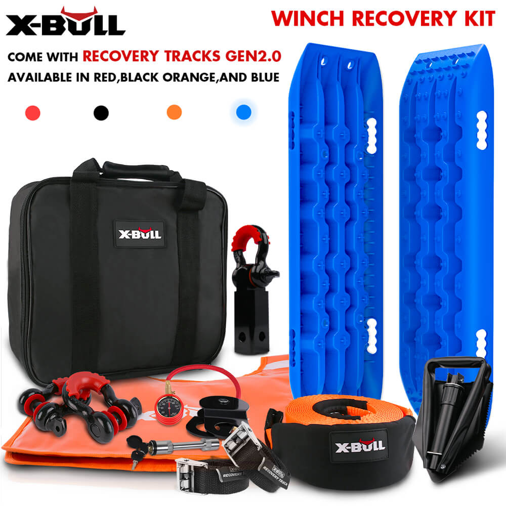 An X-BULL Winch Recovery Kit Snatch Strap Off Road 4WD with Mini Recovery Tracks Boards includes two black traction boards with handles, a black storage bag with an X-BULL logo, an orange tow strap, a multi-tool, an air pump with a pressure gauge, a small black shovel, and a pair of red and black shackles.