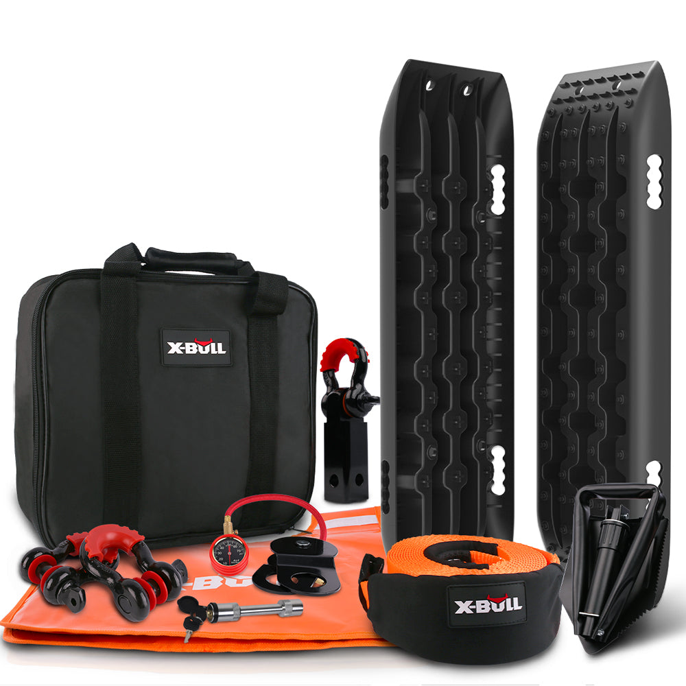 An off-road recovery kit including black traction boards, a black carrying bag, an orange and black recovery strap, red and black shackles, a shovel, and various accessories. This X-BULL Winch Recovery Kit Snatch Strap Off Road 4WD with Recovery Tracks Gen 2.0 Boards Black has all items branded with "X-Bull.