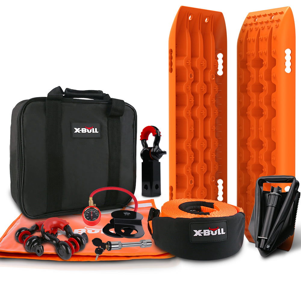 This image showcases an X-BULL Winch Recovery Kit Recovery tracks /Snatch Strap Off Road 4WD, featuring two orange recovery tracks, a black recovery bag, an orange tow strap, a tire deflator, a shovel, a pair of red shackles, and other small recovery accessories.